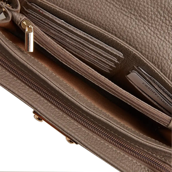 Close-up of taupe leather diabetic shoulder bag interior showing zippered compartments and card slots