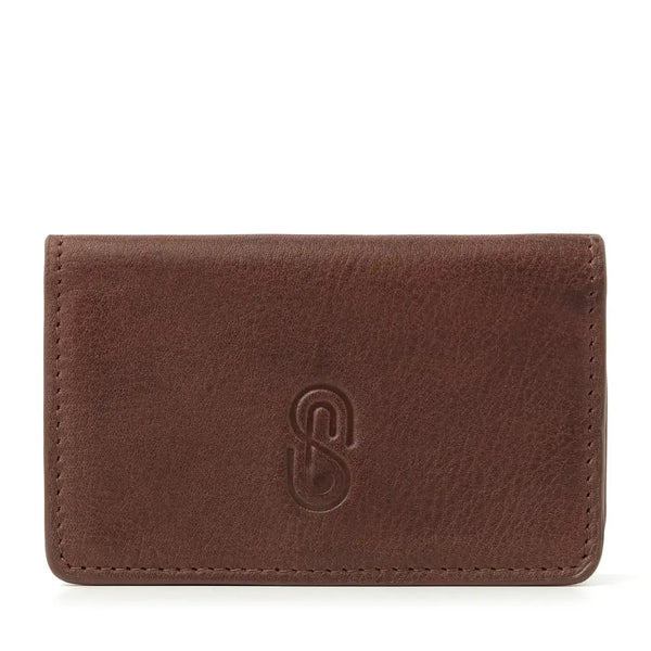 Leather insulin pump holder in brown full-grain leather with magnetic closure for diabetes management.