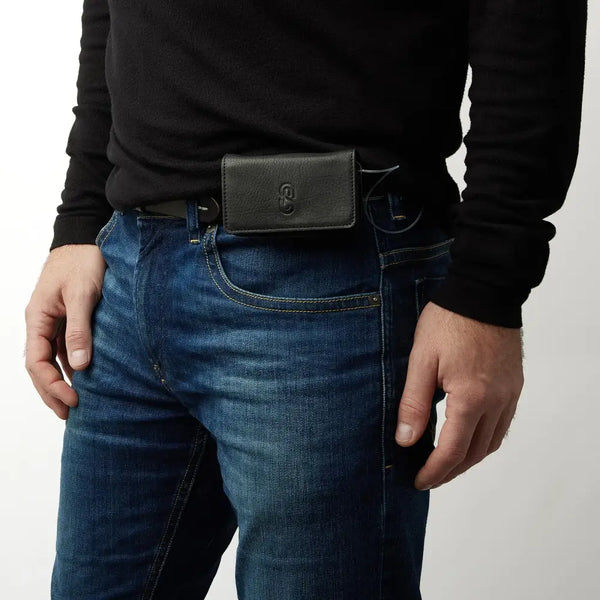 Leather insulin pump holder attached to a belt, offering easy access and secure storage for diabetes management.