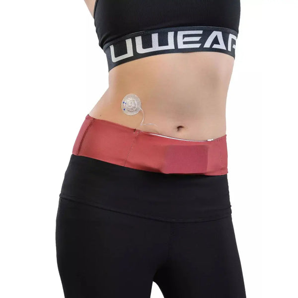 Universal Insulin Pump Waist Belt in solid color, fitted on waist with infusion tube, flexibility and comfort demonstrated.