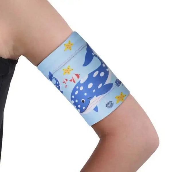 Glucose sensor armband for kids with sea-themed design, providing secure fit for active children.