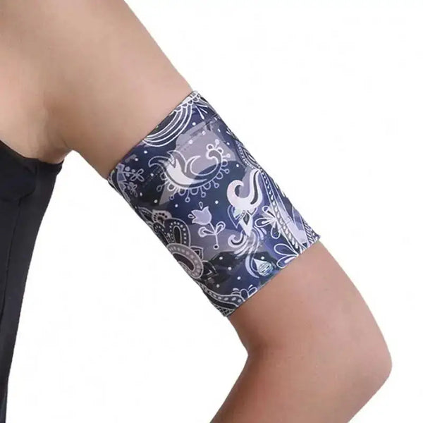 CGM armband with ethnic design, protecting glucose sensor on upper arm.