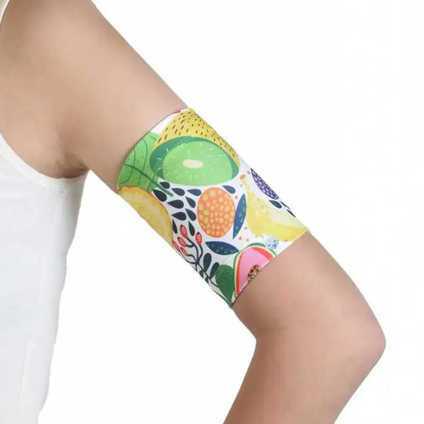 Blood glucose sensor armband with fauna and flora design for securing sensors.