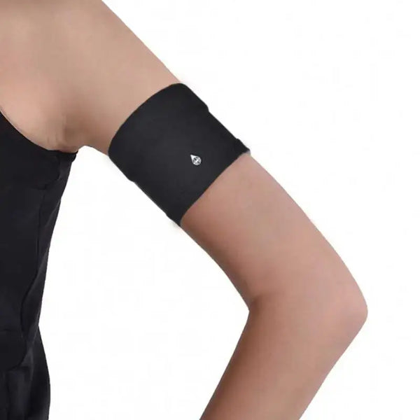 Narrow diabetic sensor armband on upper arm, breathable fabric, secure fit.