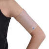 Protective armband in plain color, securing glucose sensor on upper arm.