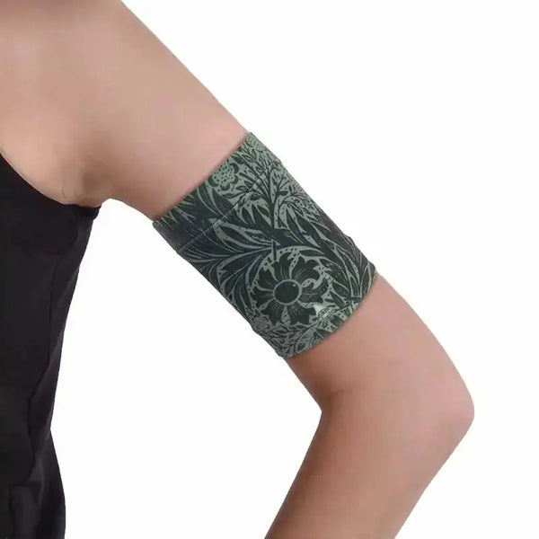 Stylish blood glucose sensor armband in dark printed colors for diabetes management.