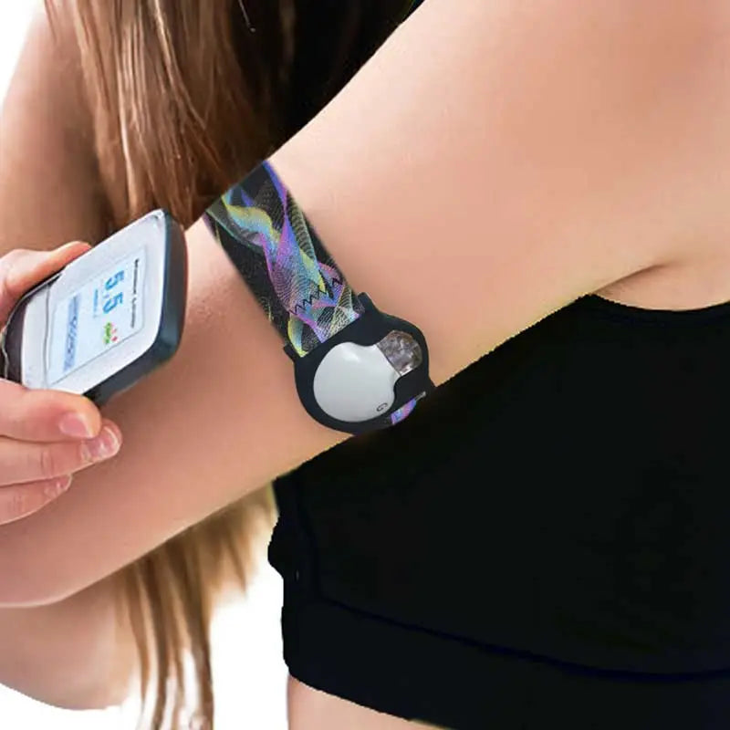 Guardian Enlite armband with glucose sensor for continuous blood glucose monitoring. Features a colorful, patterned band for secure and stylish sensor placement during daily activities or workouts. Image