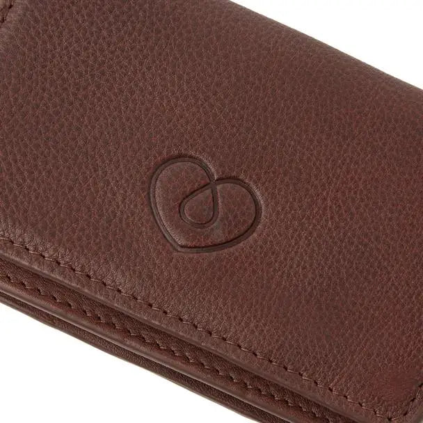 Leather insulin pump bag with embossed heart design, premium full-grain cowhide.