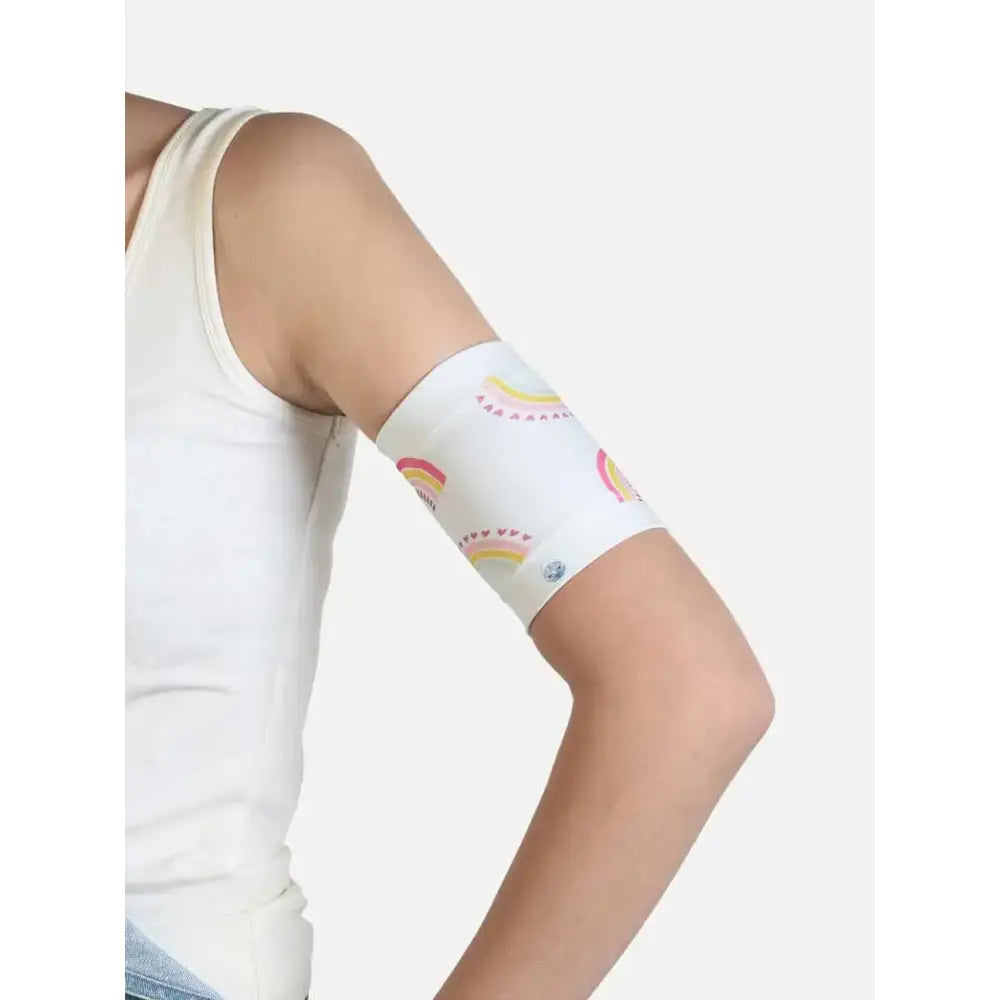Armband for children to hold and protect blood glucose sensor and pod, featuring fun patterns and secure fit for active kids.