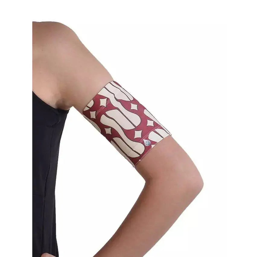 Armband securing blood glucose monitor with stylish pattern.