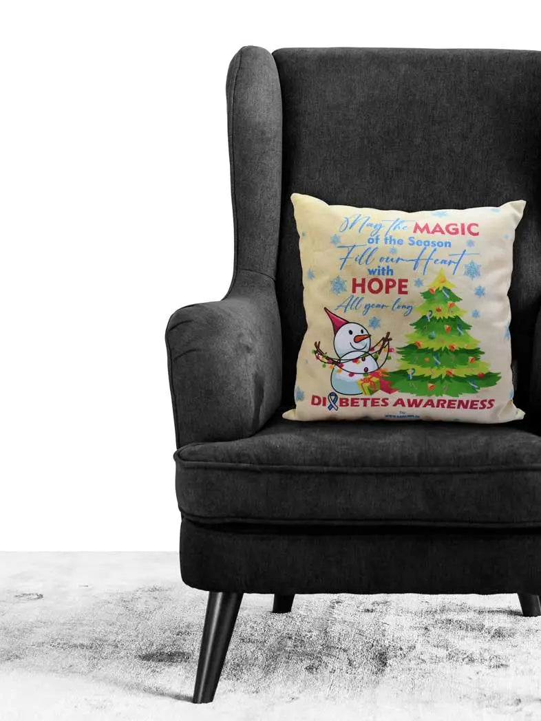 Christmas-themed Diabetes Awareness Pillow Cover on chair with festive motifs.