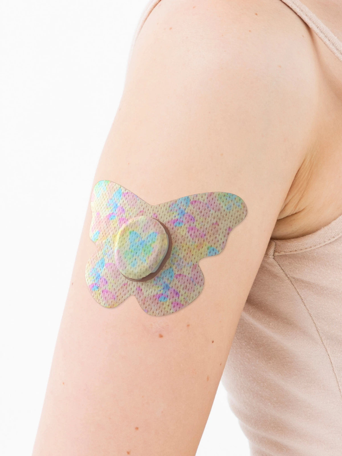 Plåster för Dexcom G7, form: fjäril, på armen, närbild