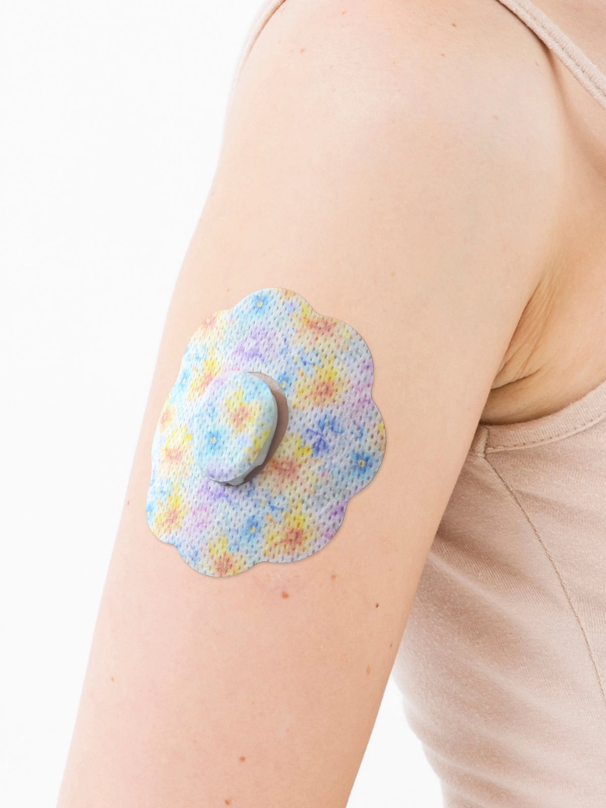Plåster för Dexcom G7, form: kaka, på armen, närbild