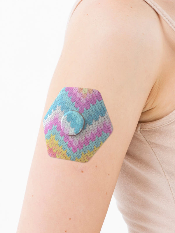FreeStyle Libre 3 hexagonal shape patch close-up on arm, showing breathable adhesive support around the sensor