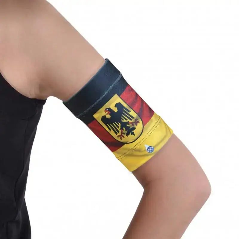 Glucose sensor armband for children with a German flag design for sports activities.