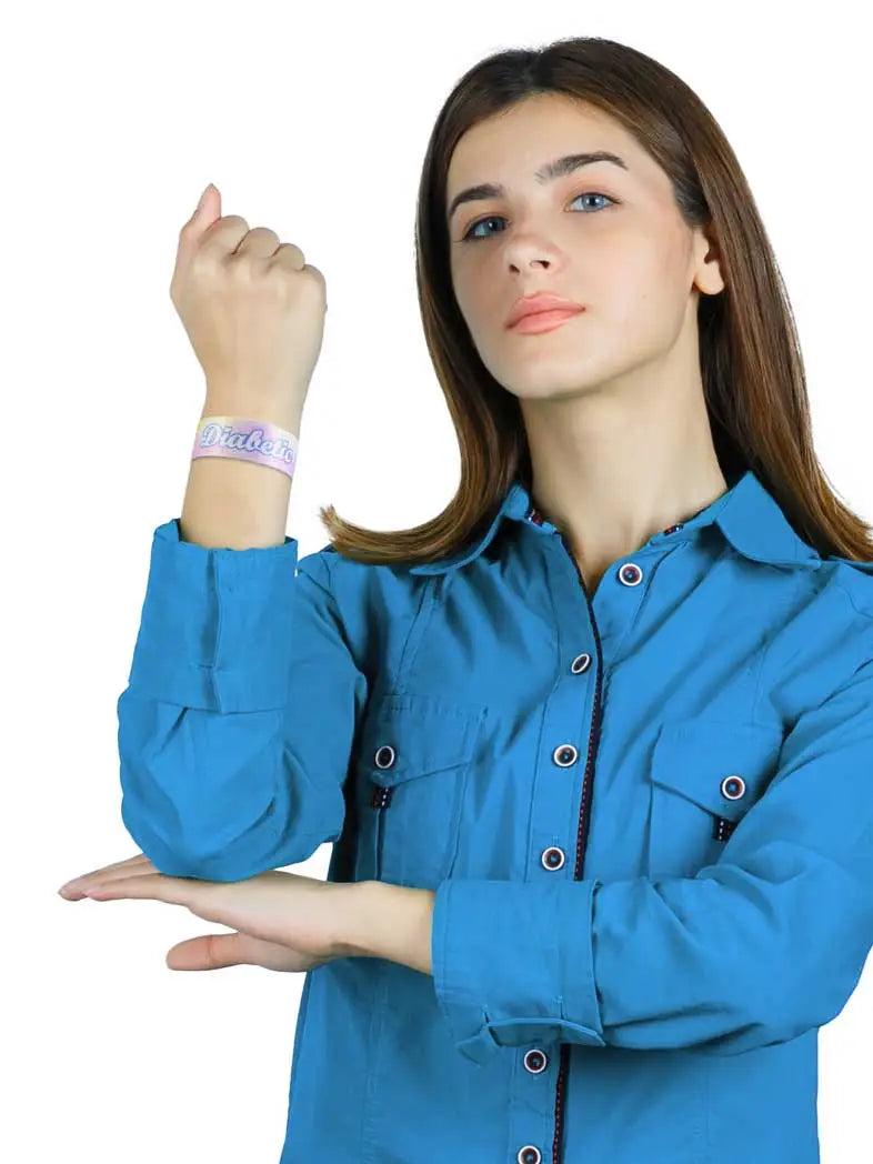 Reversible Diabetes Awareness Wristband in vibrant colors, worn by a person, featuring summer prints and the word "Diabetic".