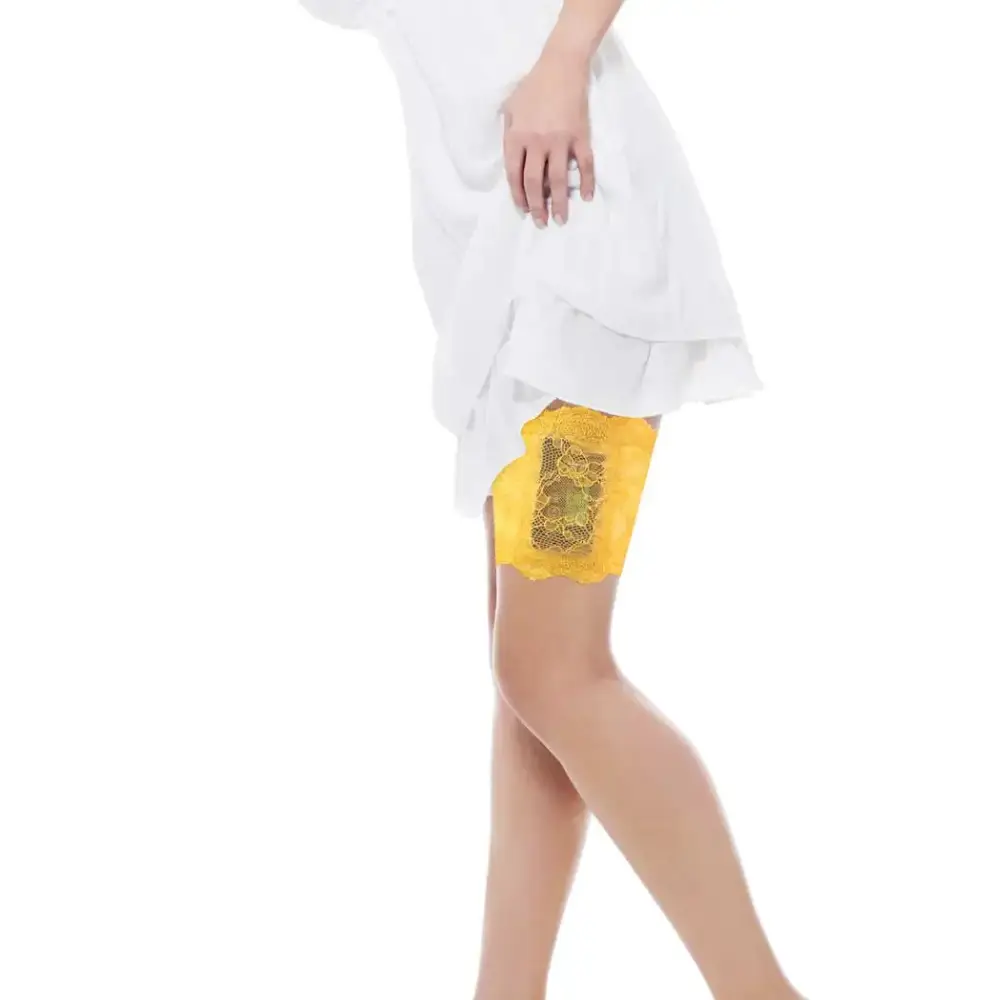 Woman wearing yellow lace garter for insulin pump under white dress
