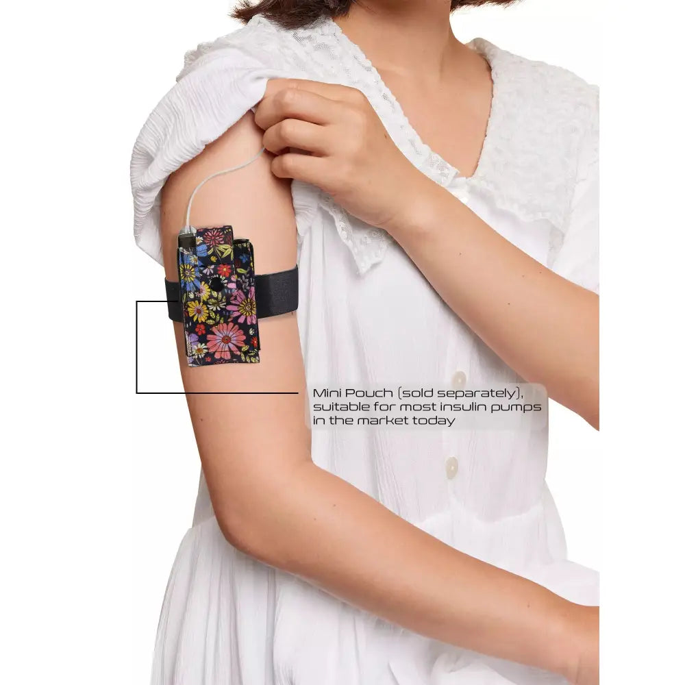 Insulin pump on arm with Dia-Arm Band.
